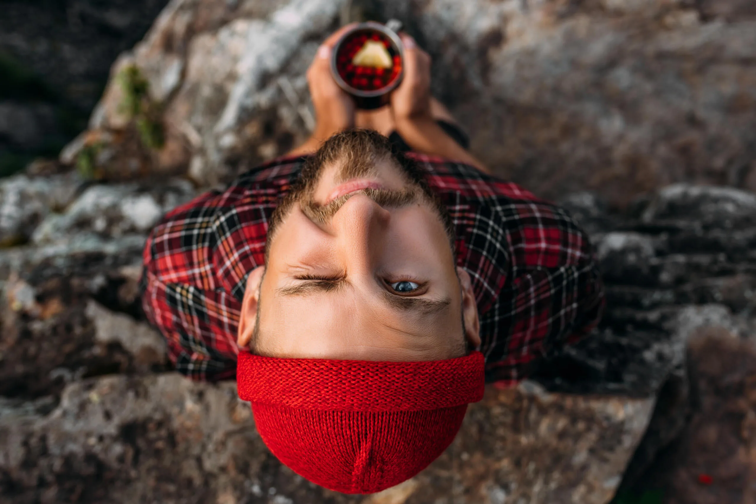 a-traveler-in-a-red-hat-looks-at-the-camera-the-c-2022-01-19-00-15-28-utc